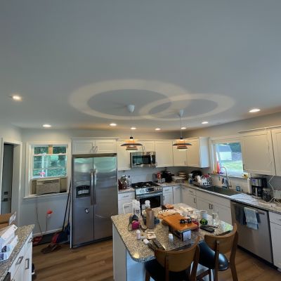 Kitchen With Modern Appliances And Lots Of Light Wood Floors