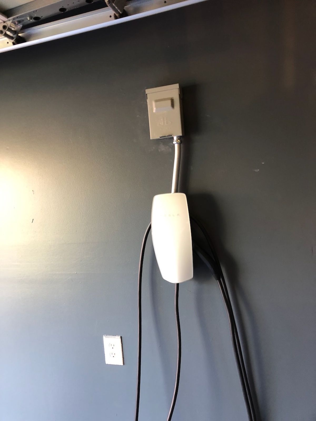 Ev Charger Mounted On Wall With Electrical Outlet And Cables Laurel Md