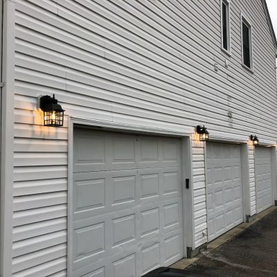Garage Door With Lighting On Exterior Of House