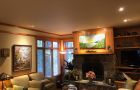 Living Room With Artwork And Cozy Furniture In Chalet Style