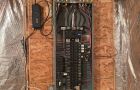 Electrical Panel With Wires And Breakers In Basement Setup