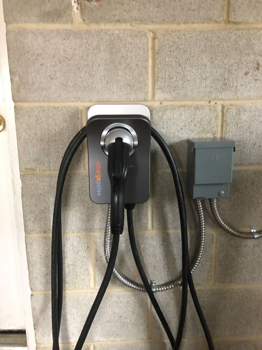 Ev Charging Station On Wall With Cables And Connection Box