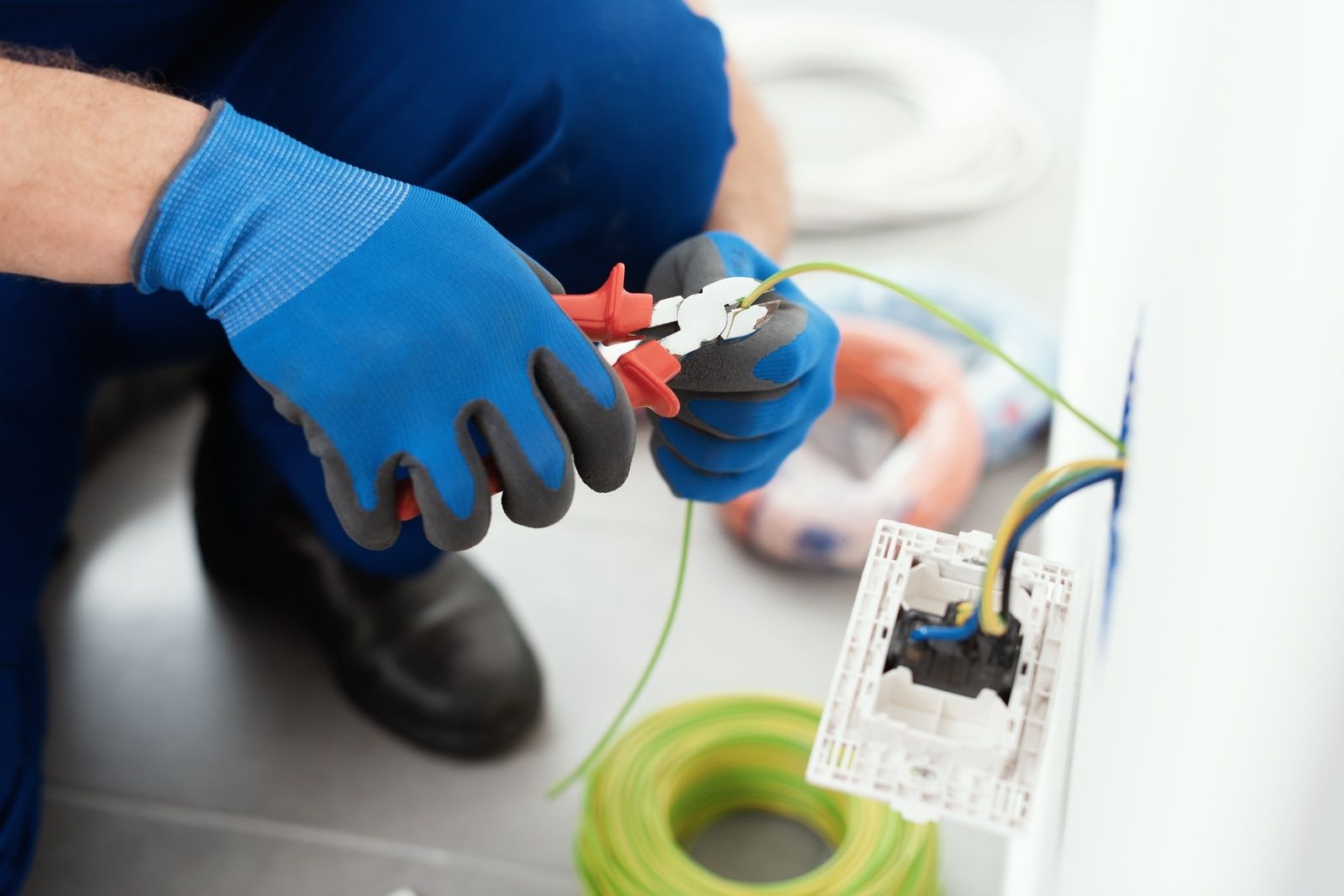 Electrician Working On Wiring With Tools And Gloves Columbia Md