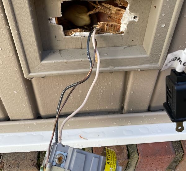 Damaged Siding With Wire Exit And Software Labels Elkridge Md