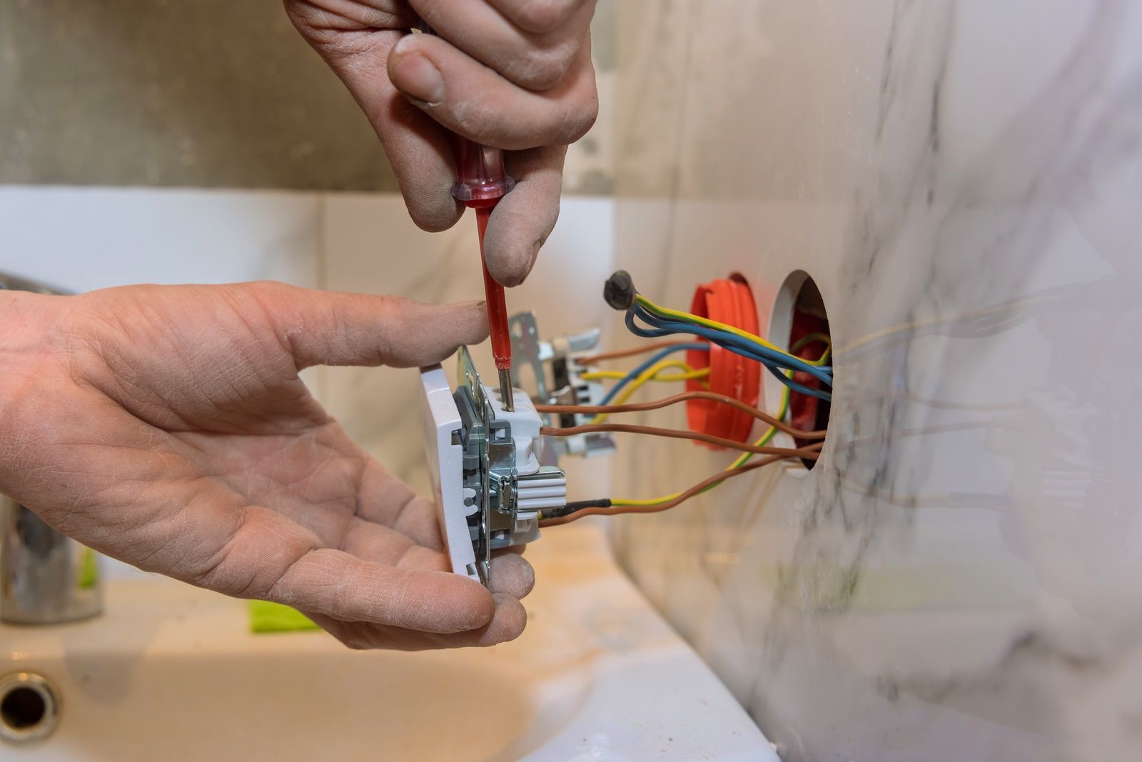 Installing Light Switch With Screwdriver And Electrical Wiring Elkridge Md