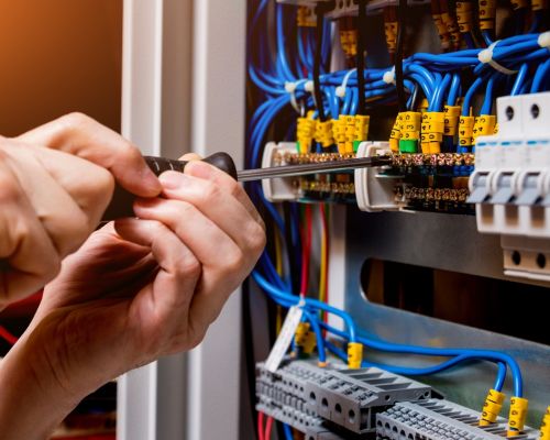 Electrical Panel Wiring Repair With Screwdriver In Hand Odenton Md