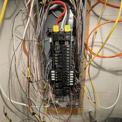 Electrical Panel With Multiple Wires And Breakers In Basement