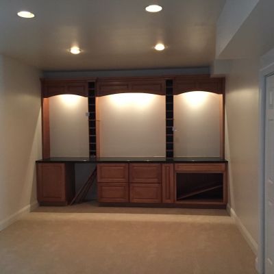 Empty Room With Wooden Cabinet And Lighting Options
