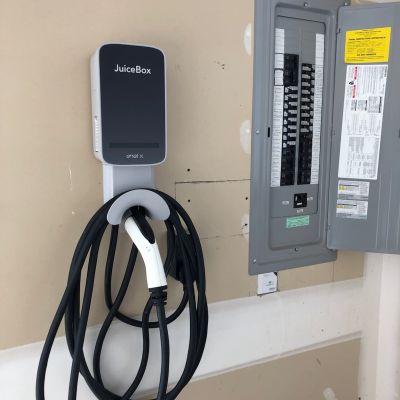 Juicebox Ev Charger Installed Next To Electrical Panel