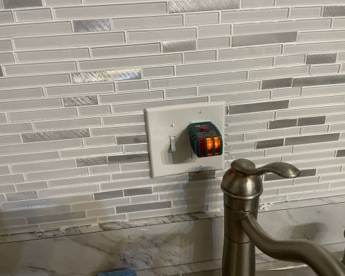 Kitchen Wall With Electrical Outlet And Faucet In Background Columbia Md