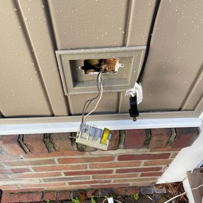 Damaged Wall Outlet With Wires And Broken Cover Plate