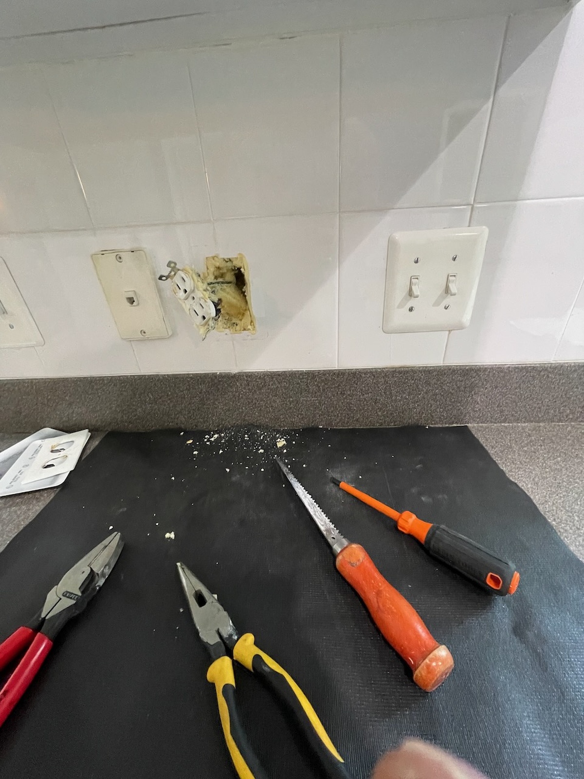 Damaged Wall Outlet Repair Tools And Debris On Countertop Columbia Md