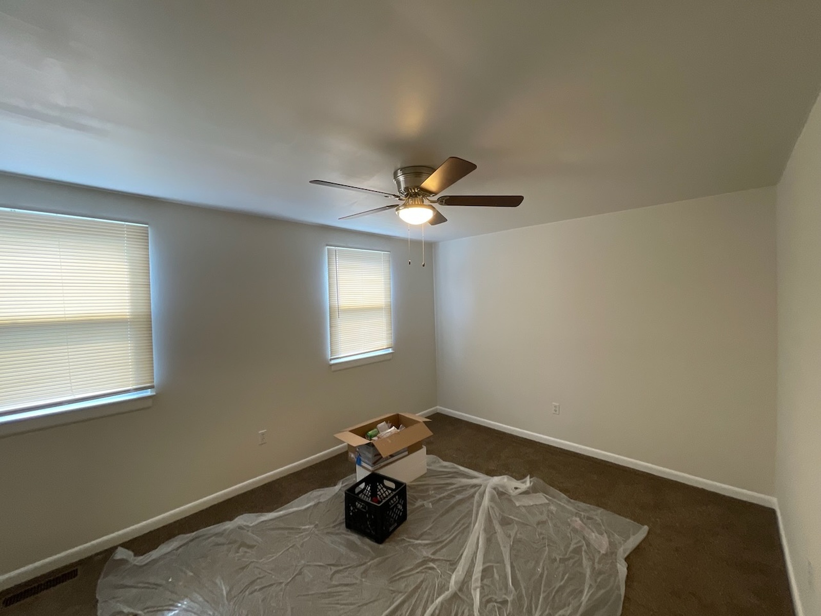 Empty Room With Blank Walls And Ceiling Fan And Box Crofton Md