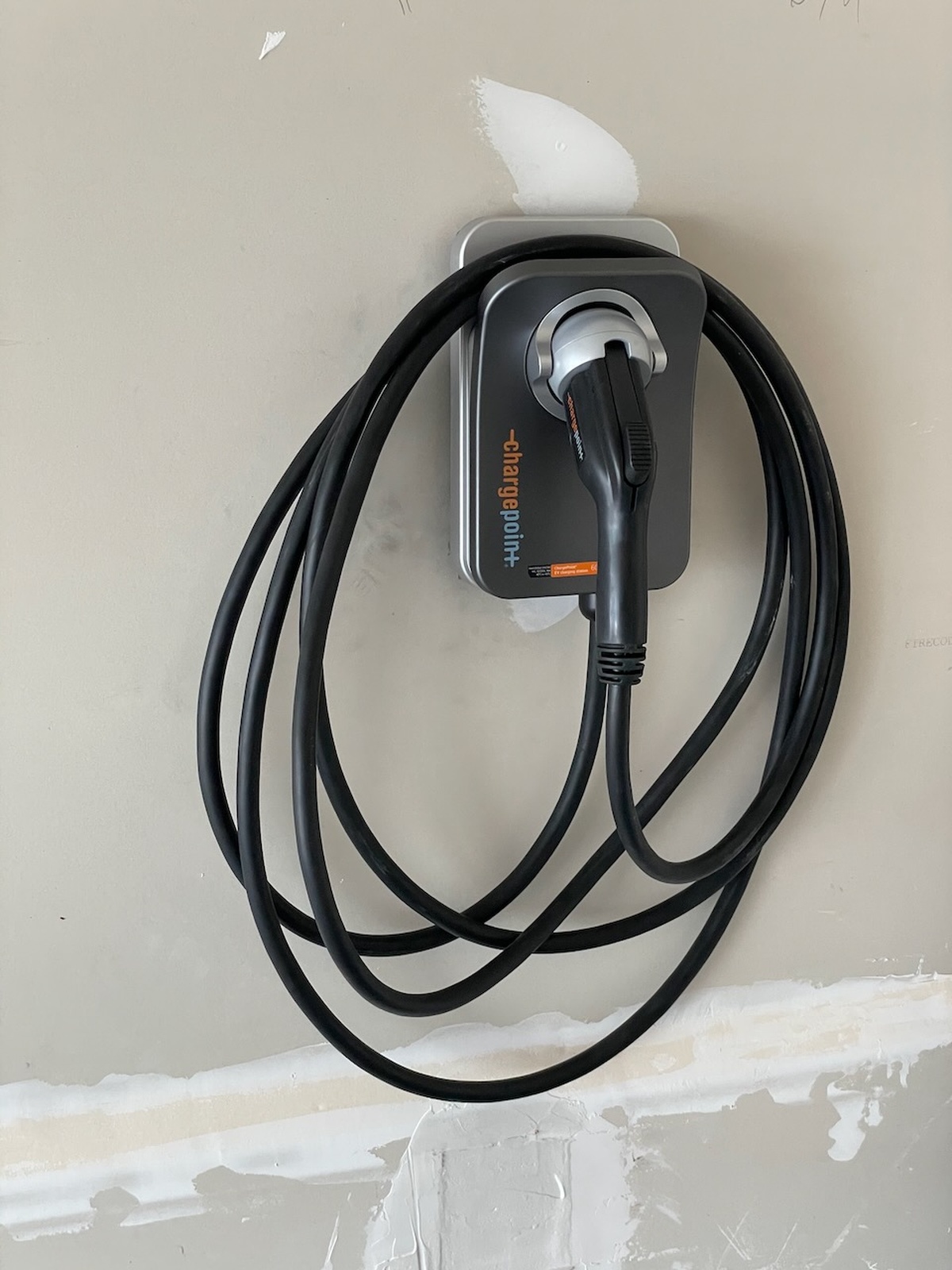 Ev Charger Mounted On Wall With Cable Coiled Configuration Bowie Md