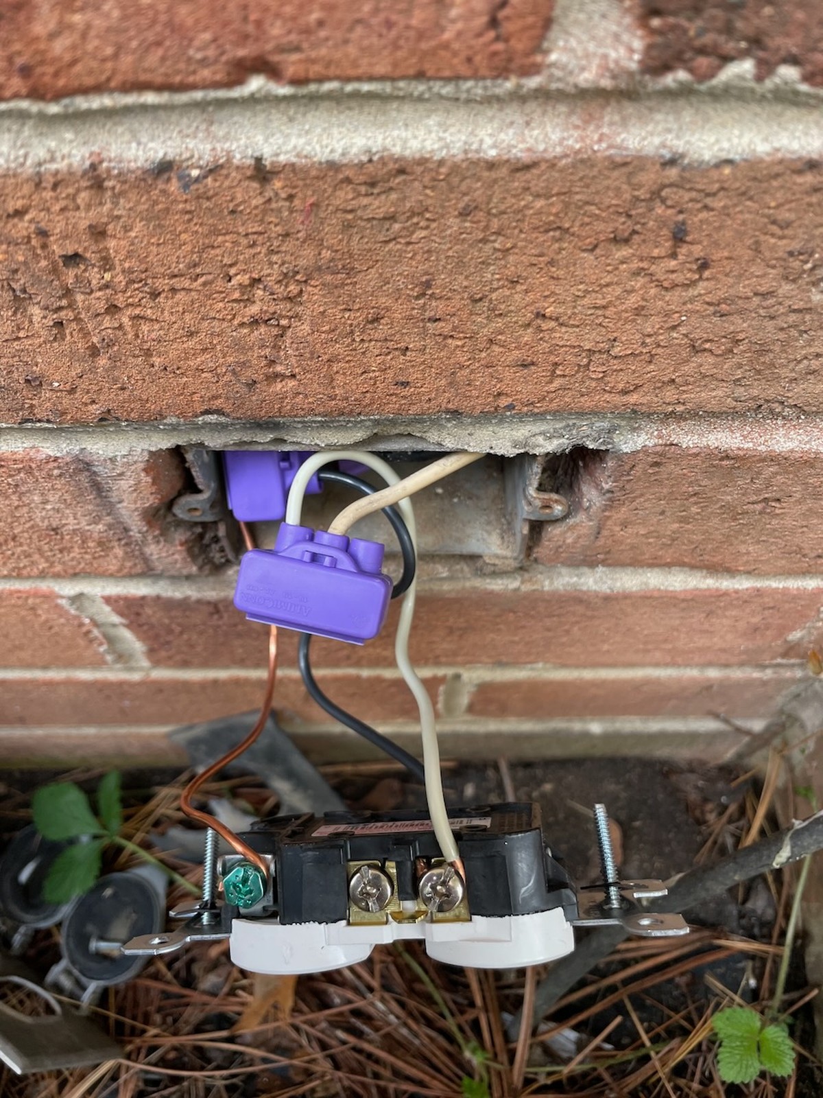 Exposed Wiring In Electrical Outlet On Brick Wall Crofton Md