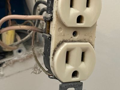 Damaged Electrical Outlet With Wires And Dust Ellicott City Md