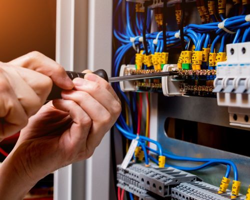 Electrical Panel Wiring Repair With Screwdriver In Hand Odenton Md