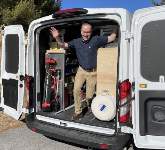 Man Standing Inside Work Van With Tools And Equipment Ellicott City Md