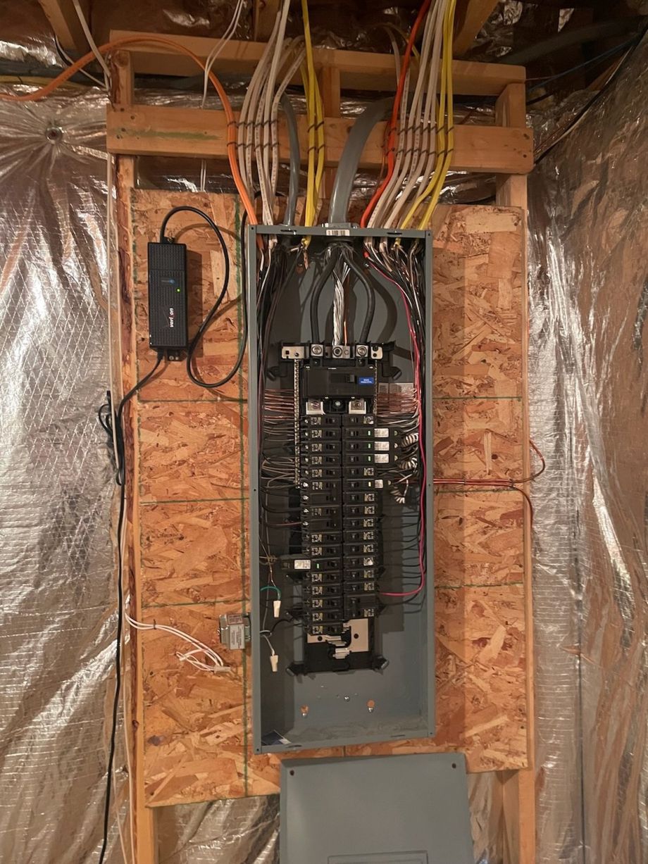Electrical Panel With Wires And Breakers In Basement Setup