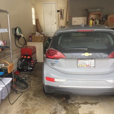 Chevrolet Bolt Ev In Garage With Tools And Storage Units