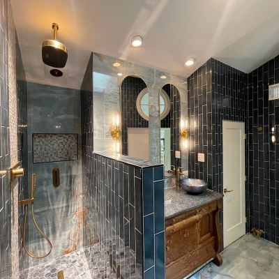 Modern Bathroom With Blue Tiles And Elegant Fixtures