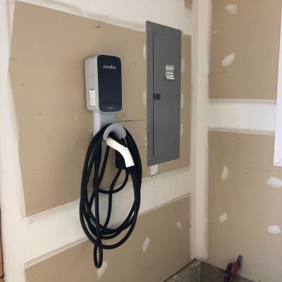 Ev Charger Installed On Wall With Cable Juicebox