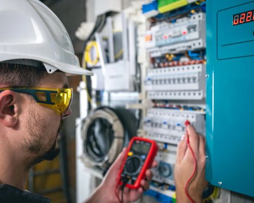 Electrician Testing Circuit With Multimeter In Industrial Setting Jessup Md