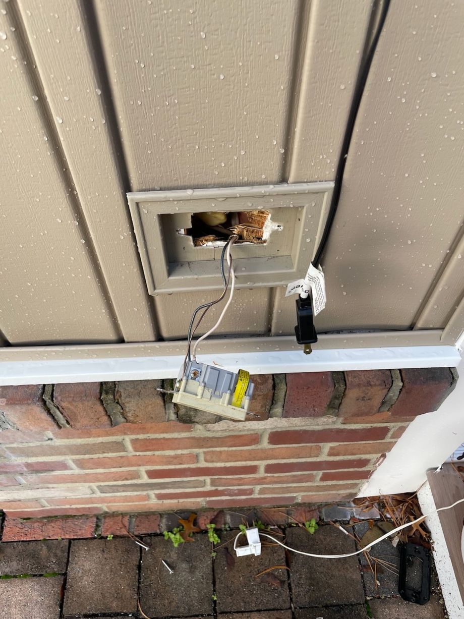 Damaged Wall Outlet With Wires And Broken Cover Plate