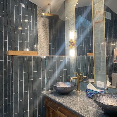 Modern Bathroom With Grey Tiled Walls And Mirrored Vanity
