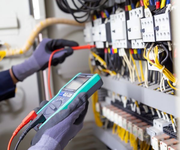 Electrical Technical Worker Testing Circuit Using Multimeter Pasadena Md