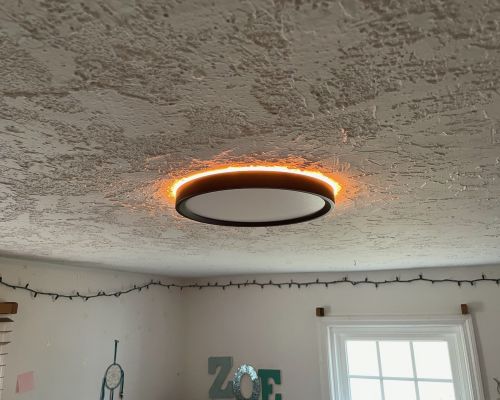 Modern Ceiling Light Fixture With Warm Glow In Room Zoe Severn Md