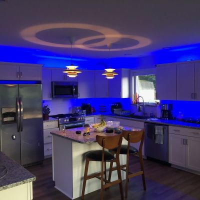 Modern Kitchen With Blue Lighting And Cozy Seating