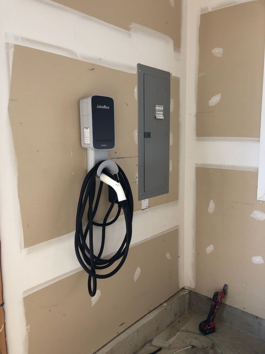 Ev Charger Installed On Wall With Cable Juicebox