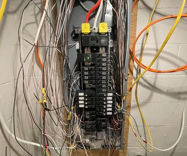 Electrical Panel With Multiple Wires And Breakers In Basement Bowie Md