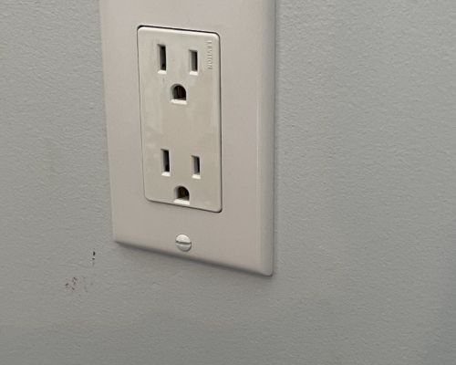 Wall Outlet On Gray Wall With White Cover Plate Ellicott City Md