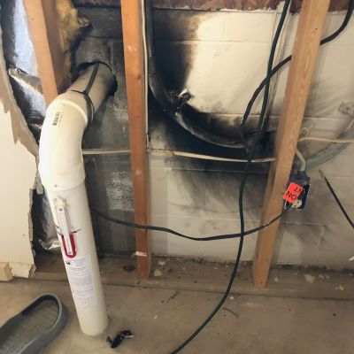 Damaged Wall Pipe Wiring Blackened Area In Basement