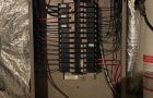 Breaker Panel In Basement With Wires And Insulation