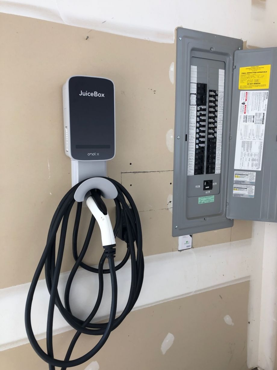Juicebox Ev Charger Installed Next To Electrical Panel