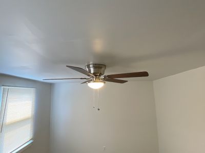 Living Room With Ceiling Fan And Light Fixture Installed Severn Md