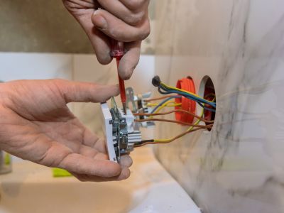 Installing Light Switch With Screwdriver And Electrical Wiring Severn Md