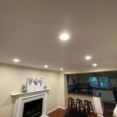 Living Room With Modern Lighting And Fireplace
