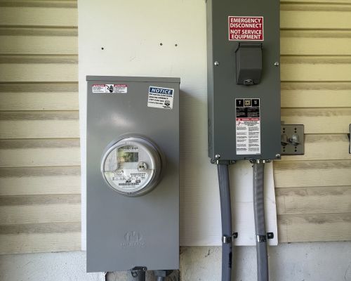 Electric Meter And Emergency Disconnect Box Mounted On Wall Marriottsville Md